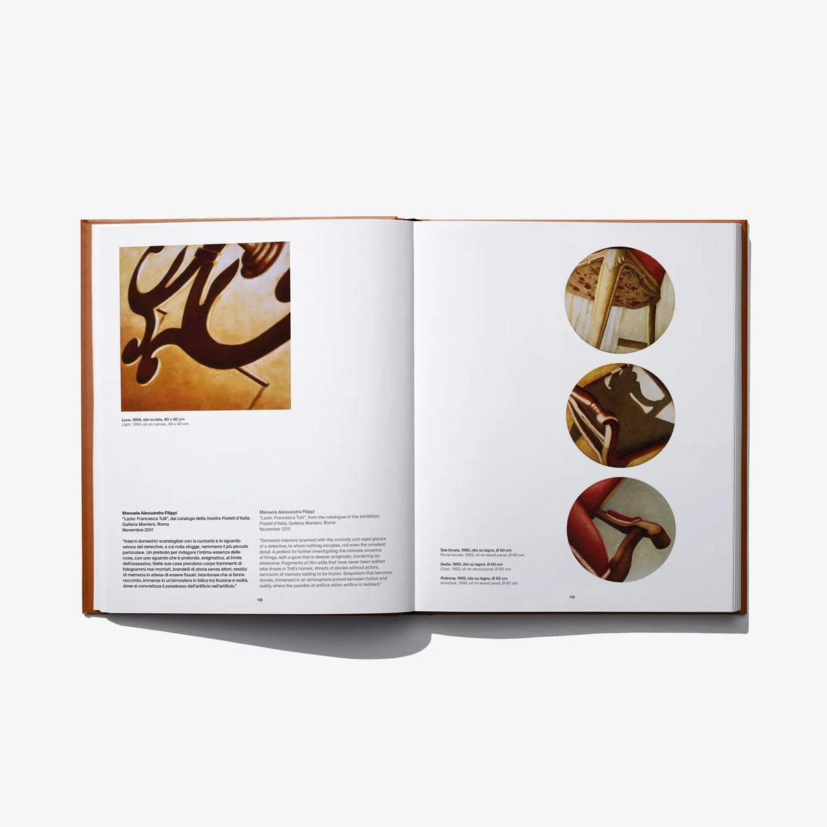 Open art book spread with four color abstract photo insets on both pages