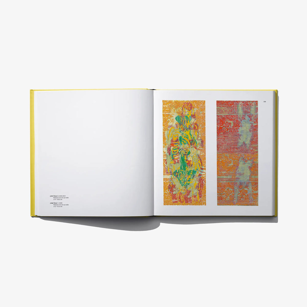 Open art book with orange and red abstract prints on two pages