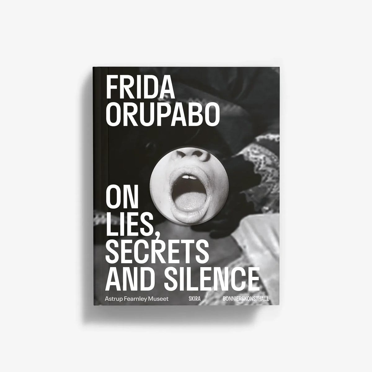 Monochrome photo book cover with face close-up and large title typography