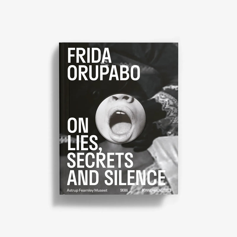 Monochrome photo book cover with face close-up and large title typography