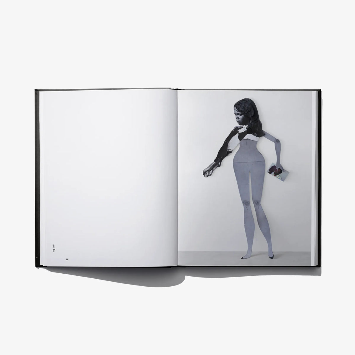 Open photo book spread with full-body portrait and plain white opposite page