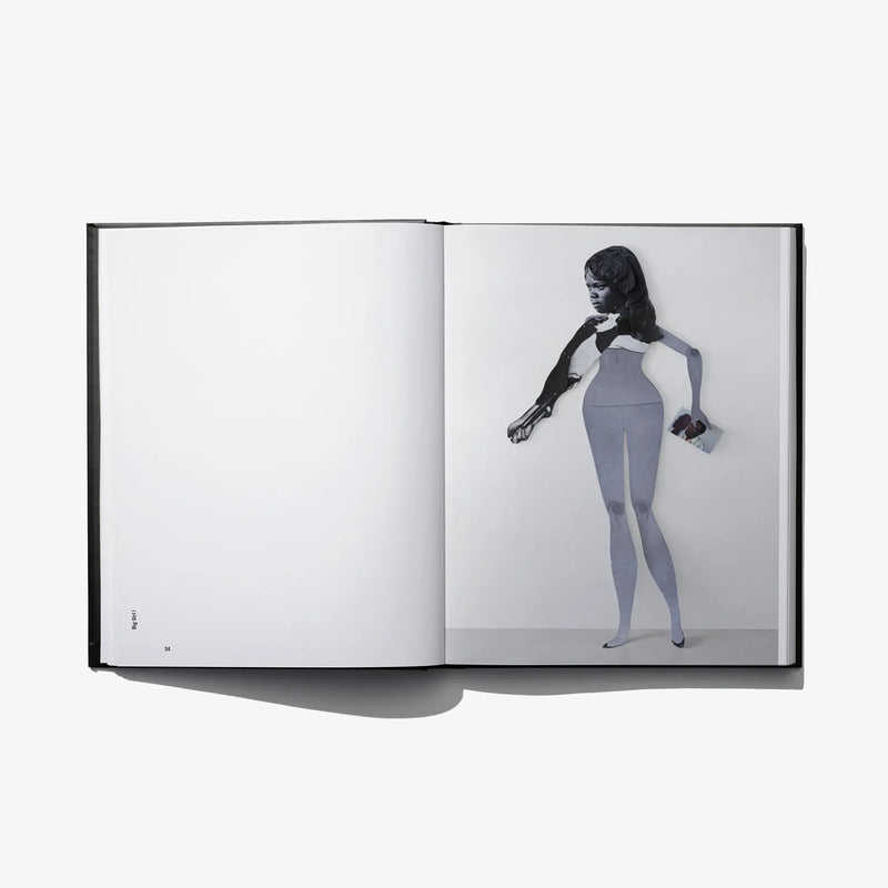 Open photo book spread with full-body portrait and plain white opposite page