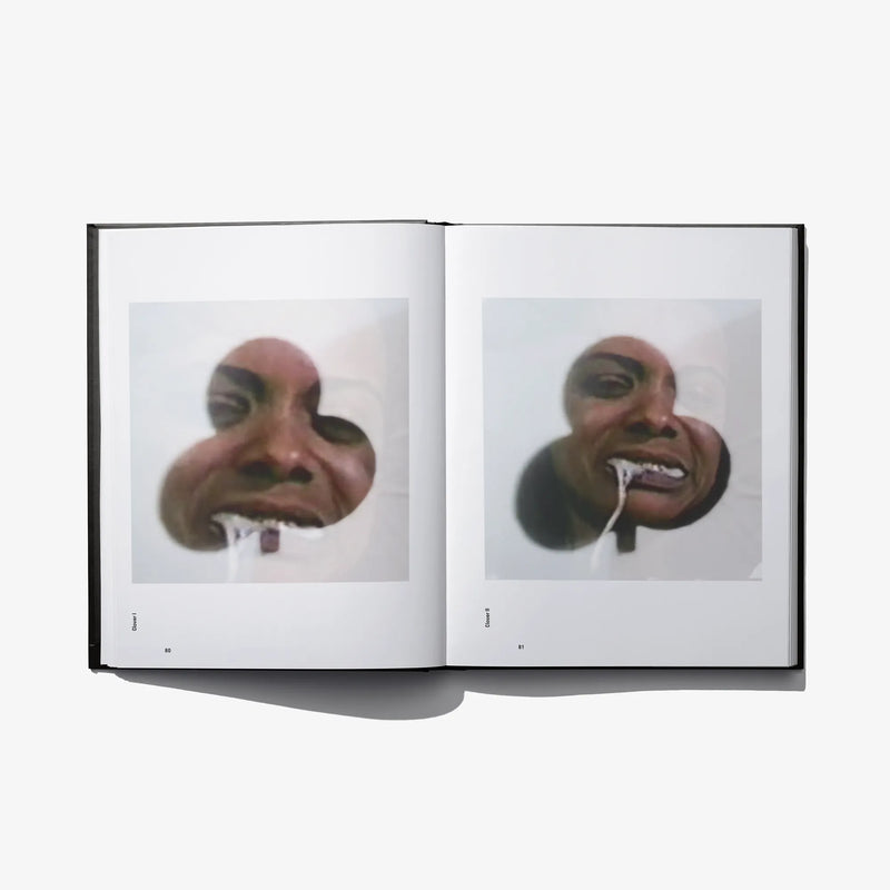 Open photo book spread with two close-up faces and small caption text blocks