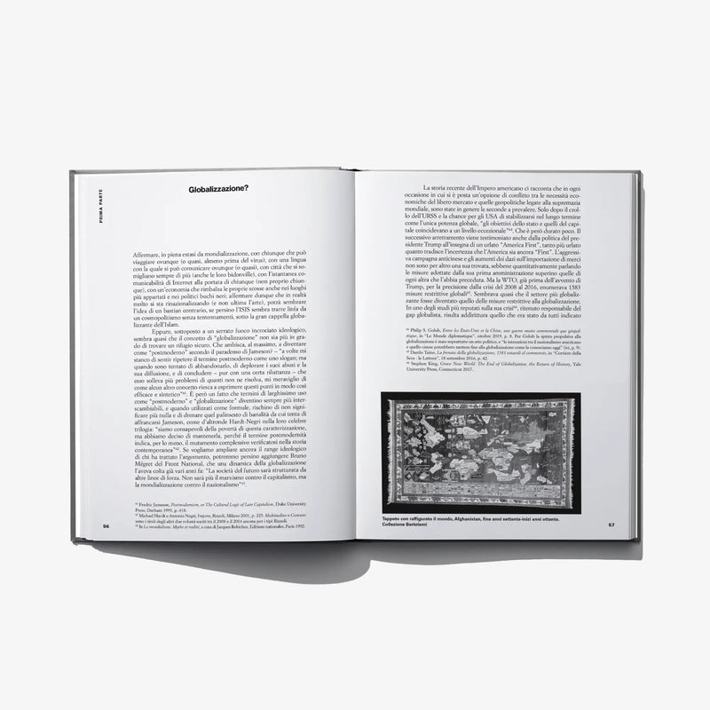 Open hardcover art book with paragraph text and small grayscale illustration
