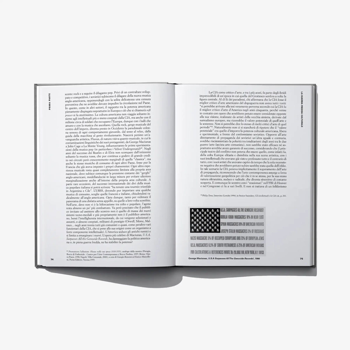 Open hardcover art book with dense text and a small block graphic
