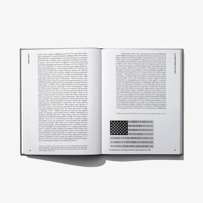Open hardcover art book with dense text and a small block graphic
