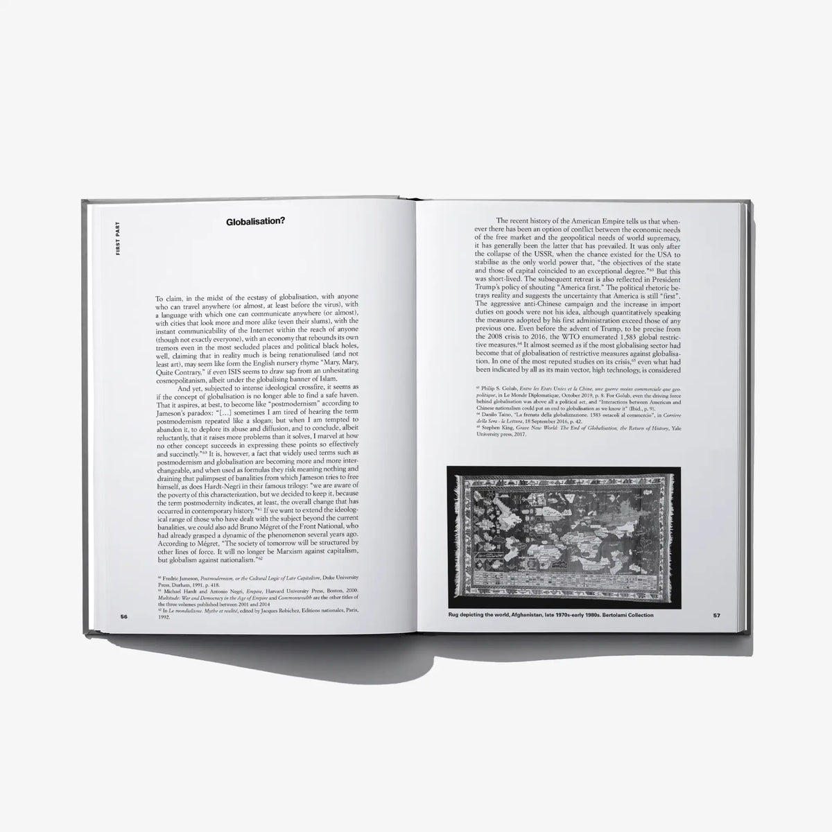 Open hardcover book spread with heading, dense text, and small black-and-white photo
