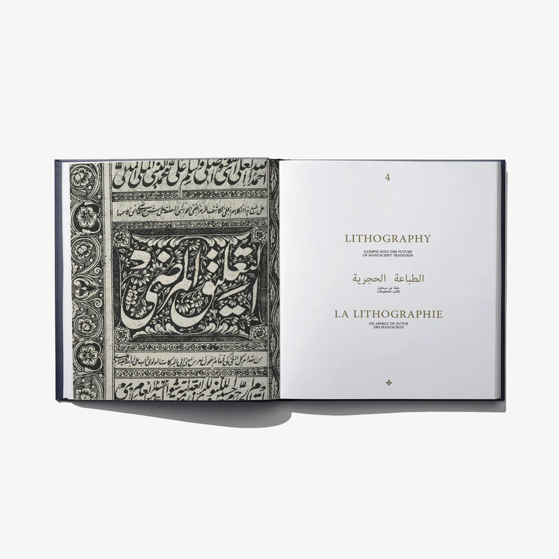 Open book spread featuring black-and-white calligraphy lithography on the left page.
