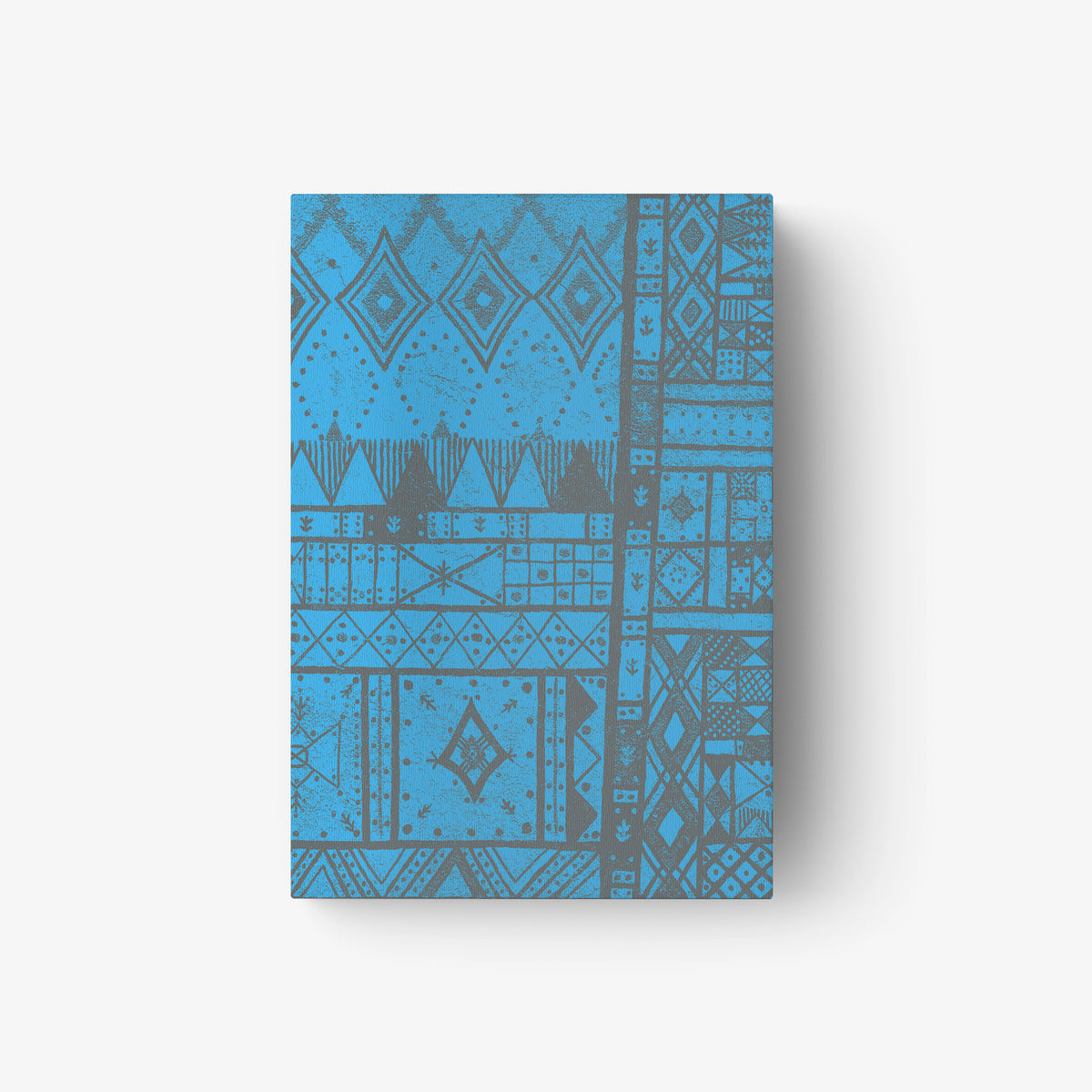 Blue patterned book cover with geometric motifs and abstract design