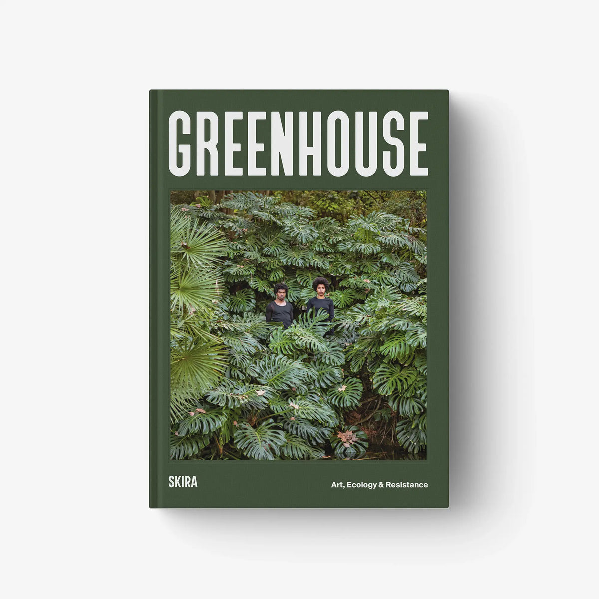 Green hardcover book with GREENHOUSE title and jungle plant photo on the cover