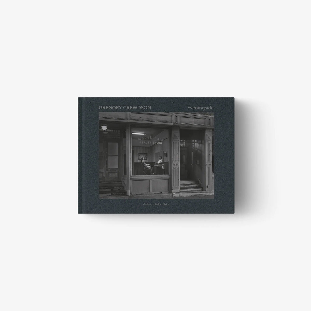 Hardcover photo book cover with dark illustrated storefront and title text