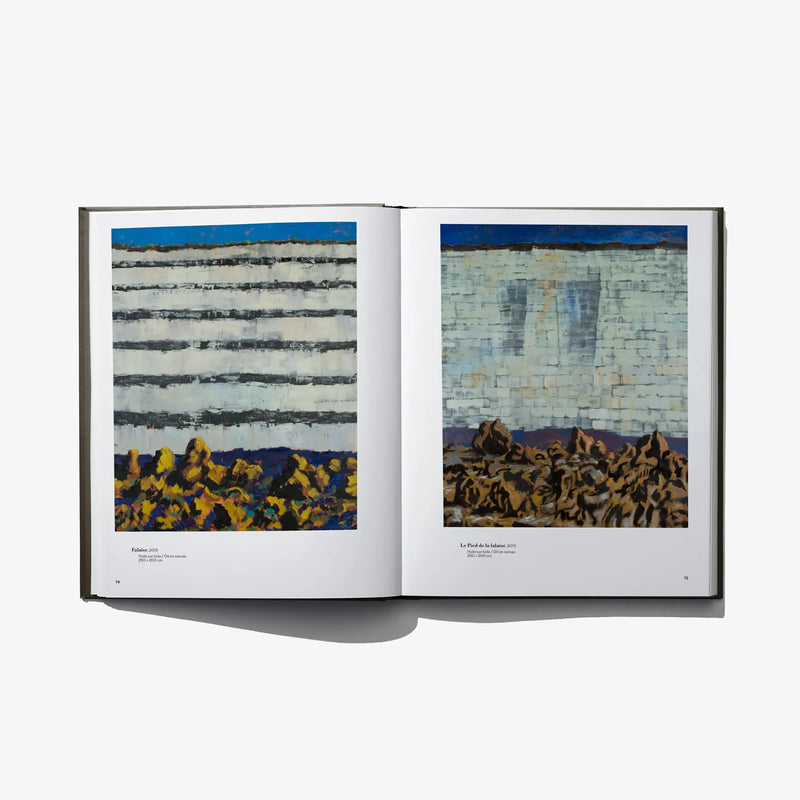 Open art book with two painted scenes: striped buildings on the left, crowd near a wall on the right.