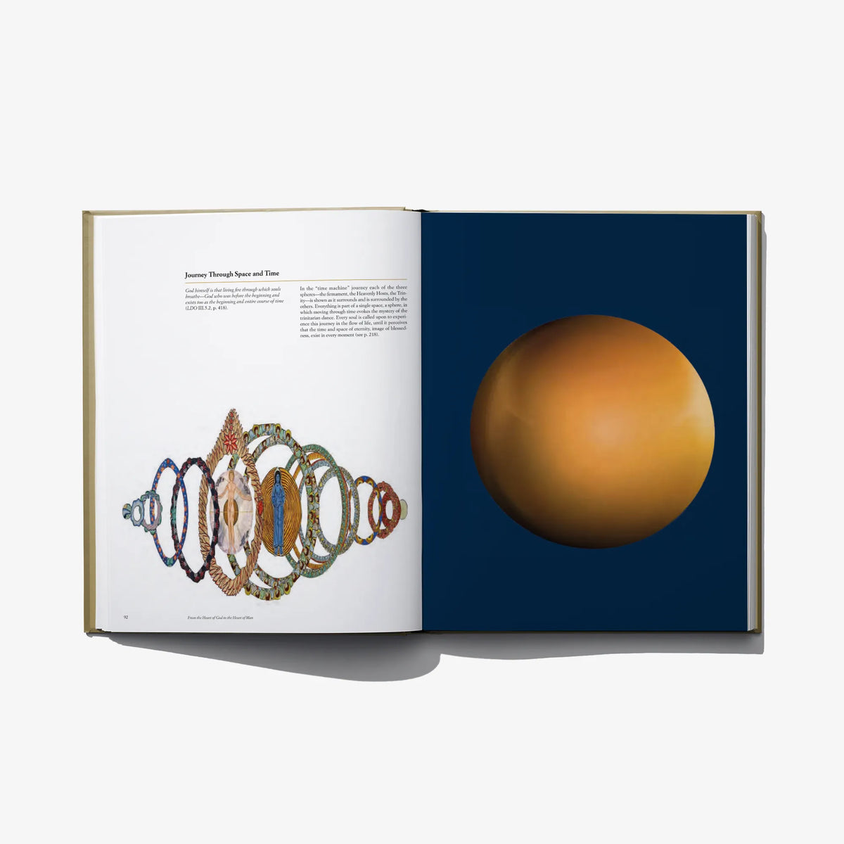 Open book with beaded ornament diagram on the left and large golden sphere graphic on the right