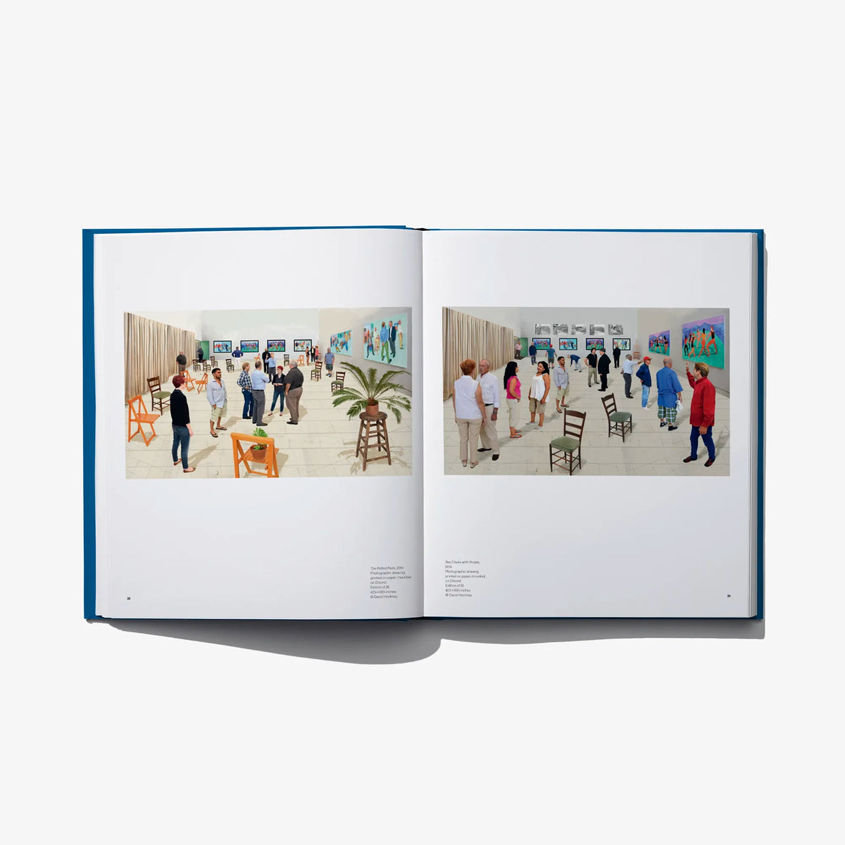 Open art book spread showing a gallery exhibition with framed colorful artwork