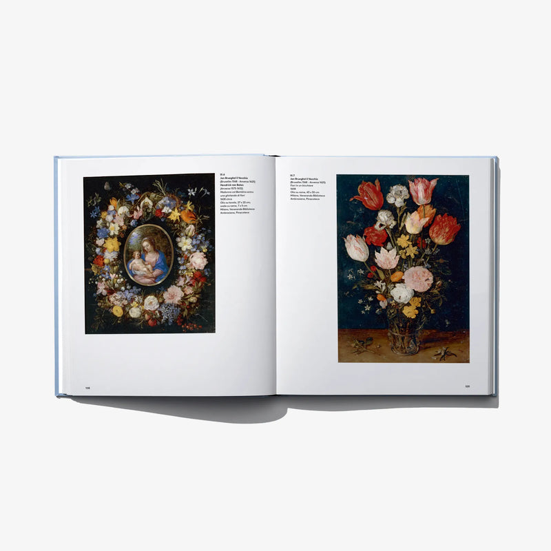 Open art book spread with floral still-life paintings on dark backgrounds