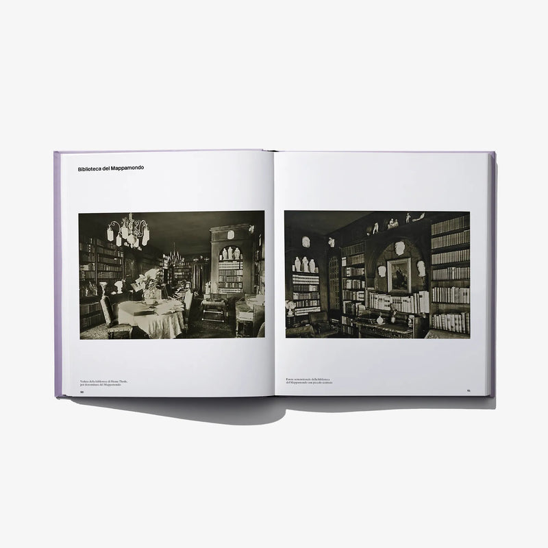Opened photo book spread with two black-and-white interior photographs and captions