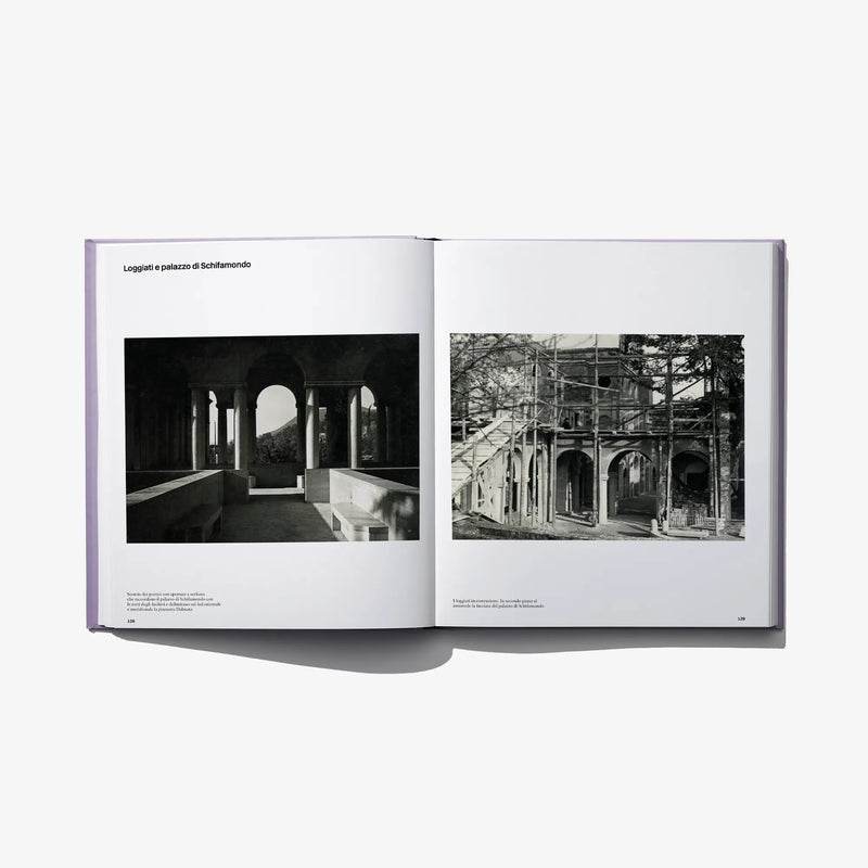 Opened photo book spread with two black-and-white archway photographs and captions