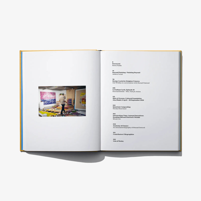 Open art book spread with printed text and a small color artwork photo