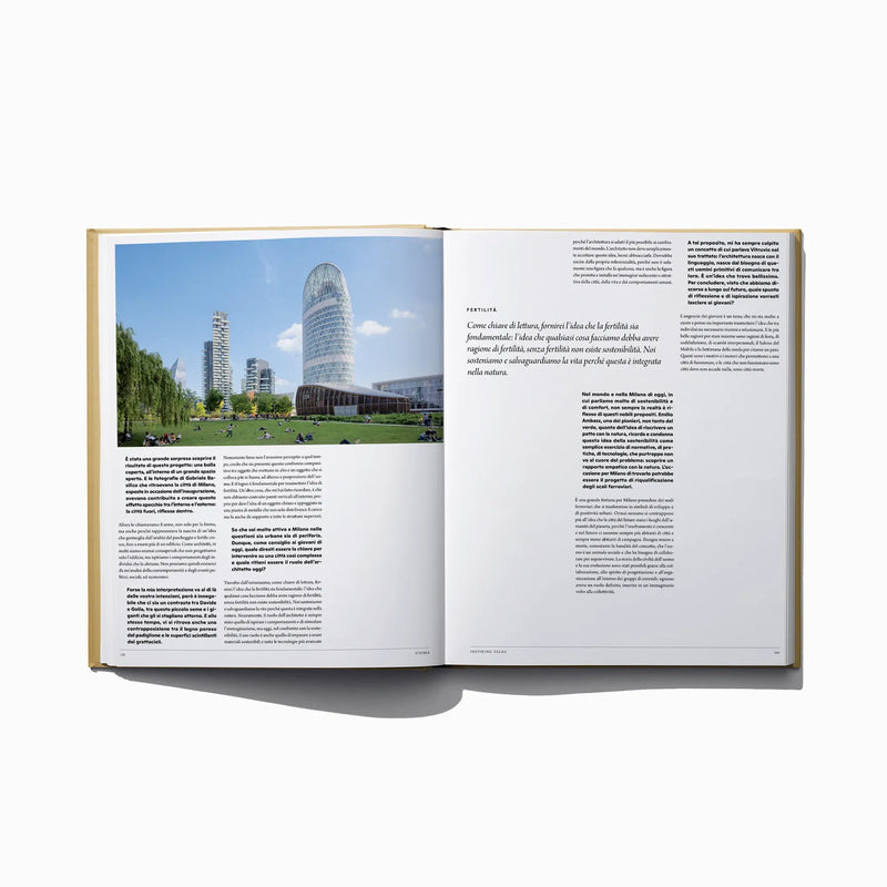 Open Italian edition city inspiration book with two-page layout, text columns and skyline photo