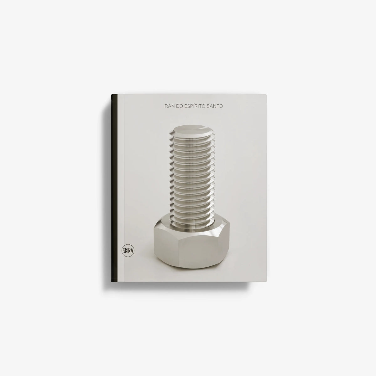 Contemporary art sculpture in stainless steel by Skira Arte, with stacked circular discs on a white plinth