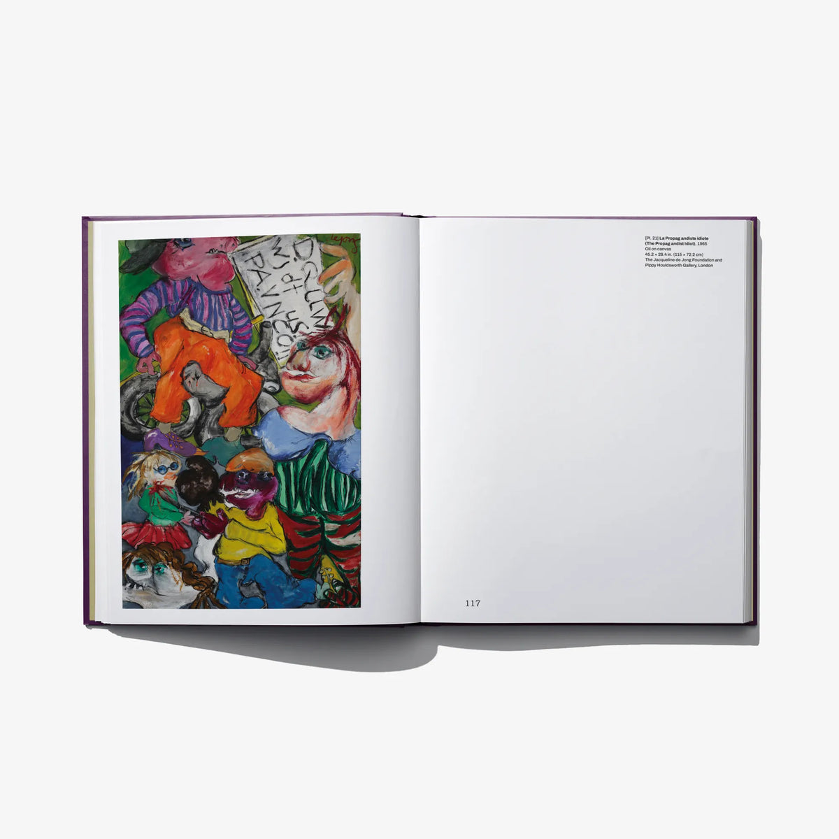 Hardcover art book open spread with colorful abstract collage left and blank page area right.
