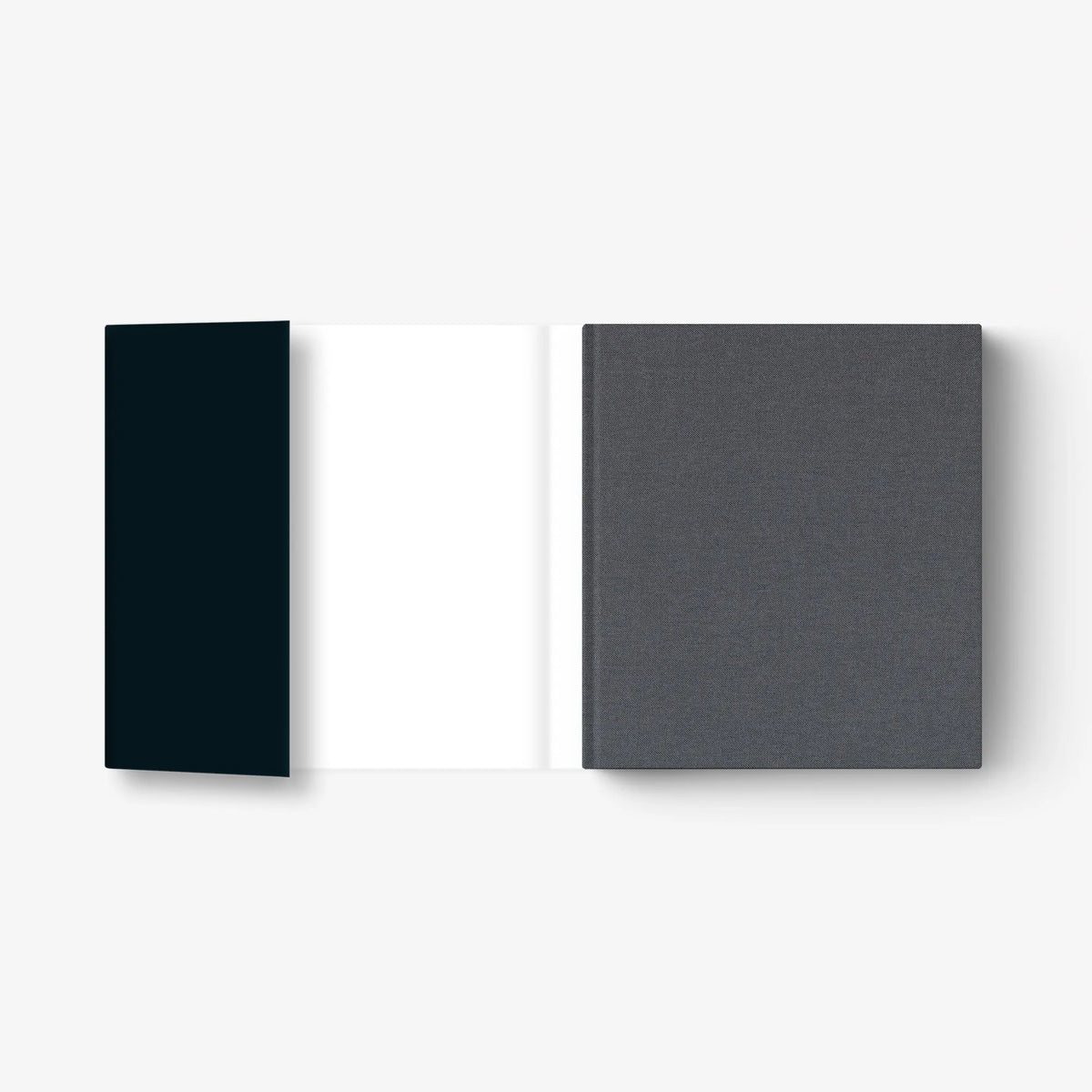 Hardcover art book with dark blue spine and textured gray back cover