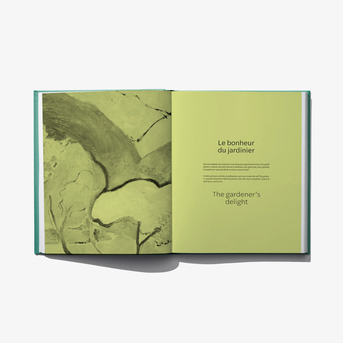 Open landscape design book with green abstract illustration on left and blank green page