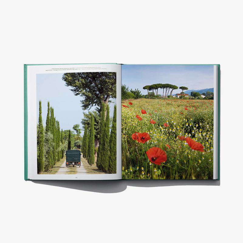 Open landscape design book with pathway photo left page and wildflower meadow photo right