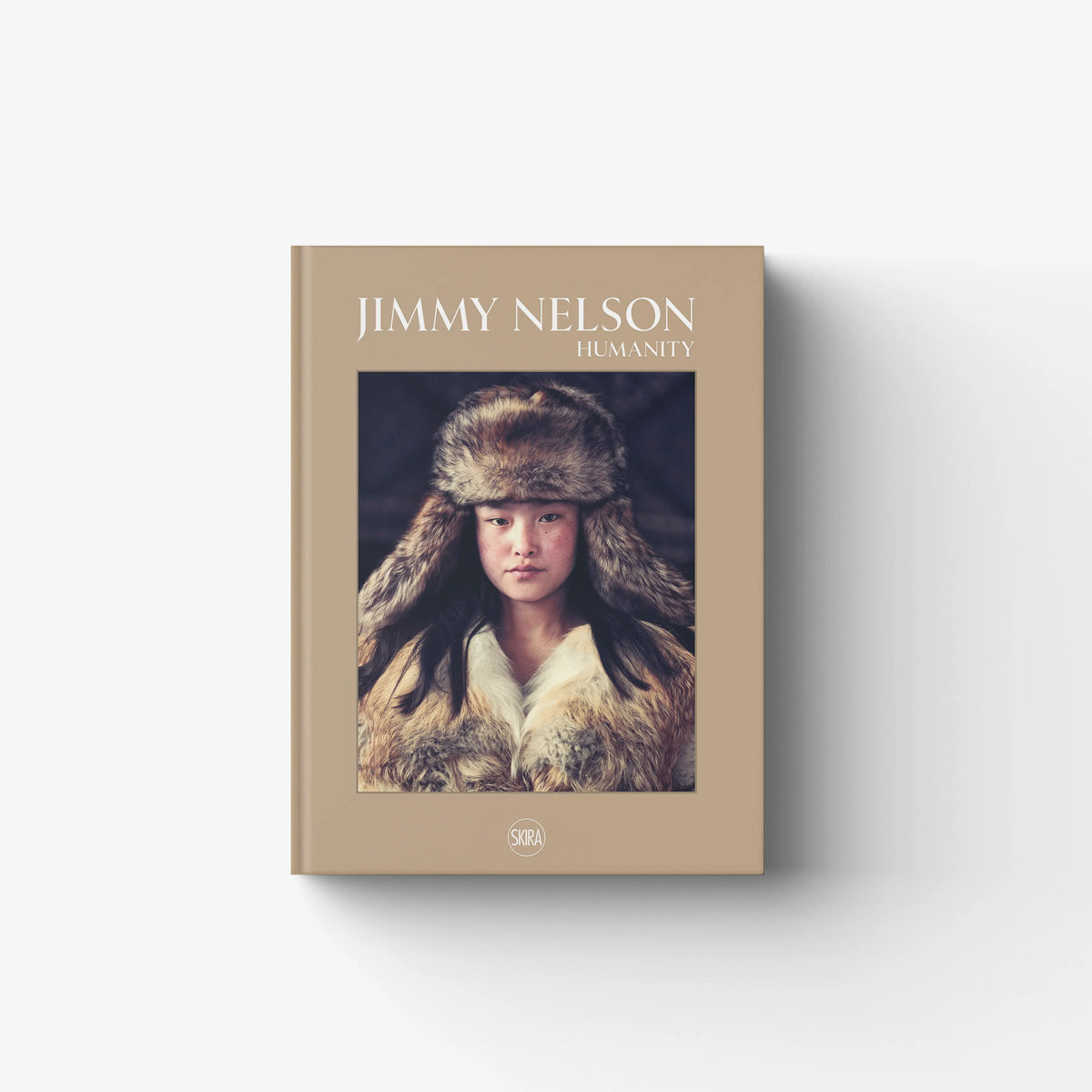 Photography book in beige with portrait cover, Skira Arte Jimmy Nelson Humanity, analogue photography with 10x8 negatives