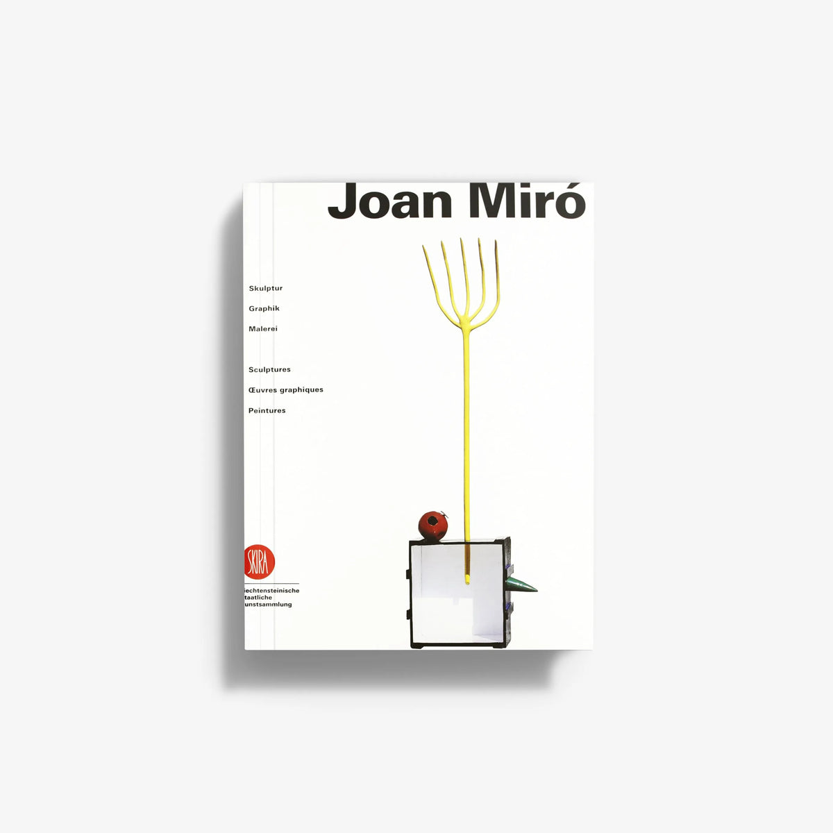 Joan Miró art book with white cover, black title, yellow line drawing, and abstract object.
