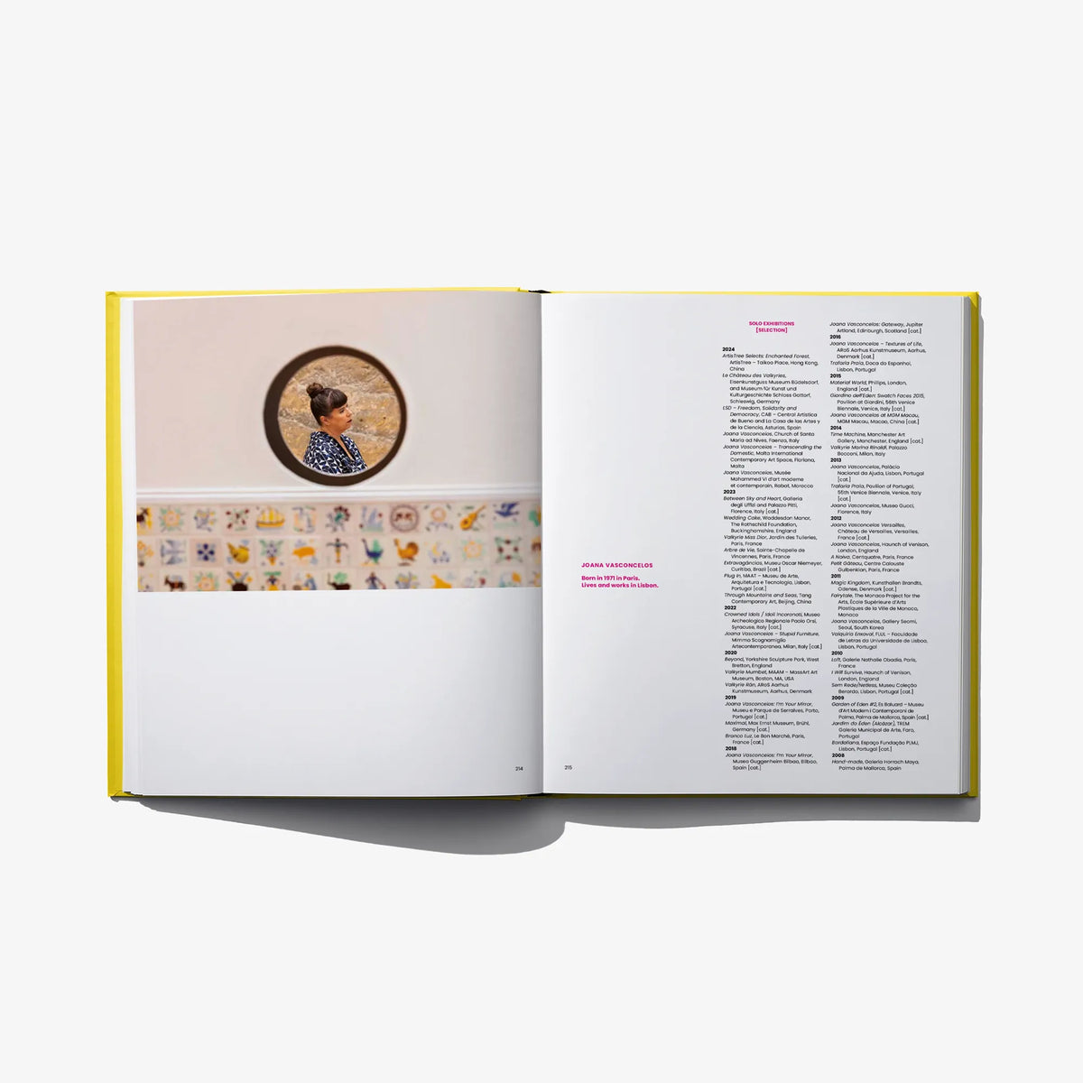 Open art book spread with small circular portrait and multi-line bibliography text.