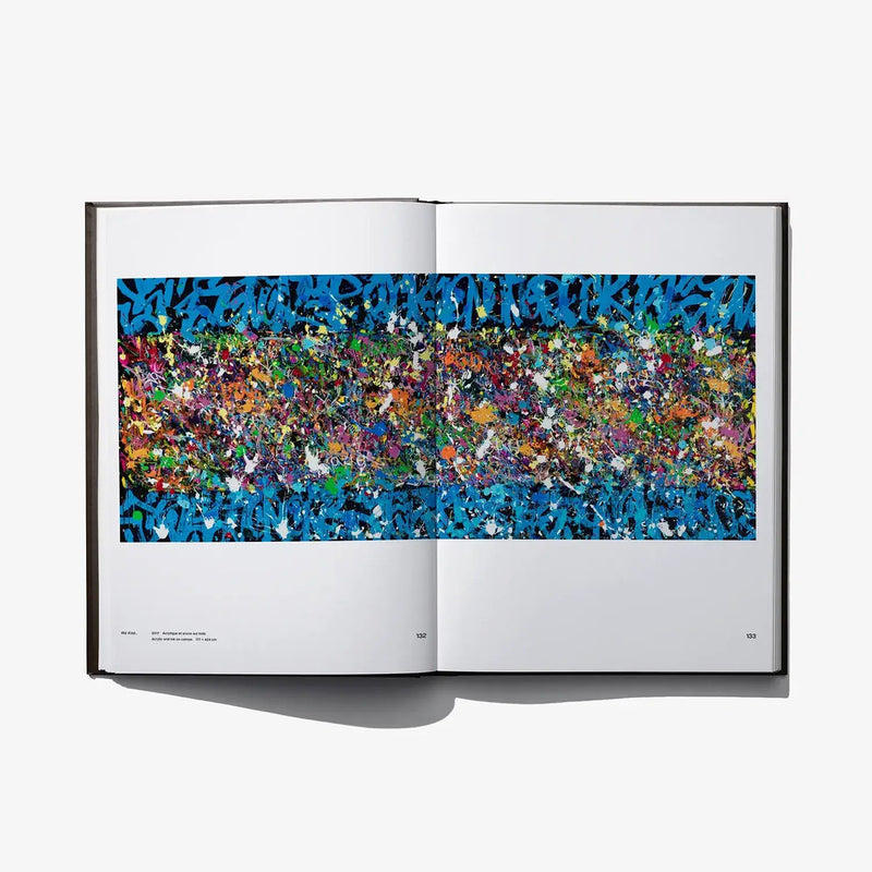 Open art book spread with wide blue colorful abstract graffiti-style artwork