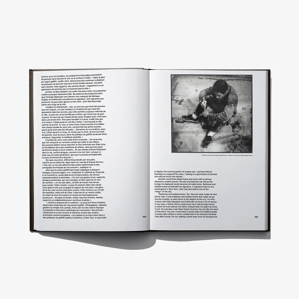 Open art book spread with paragraph text and black-and-white portrait photo