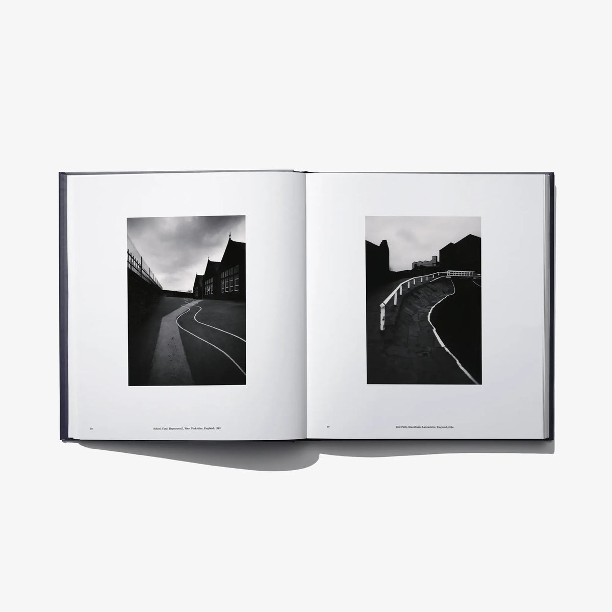 Open book “Constellation” with two black-and-white landscape photos on facing pages.