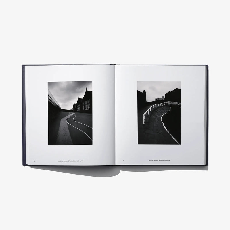 Open book “Constellation” with two black-and-white landscape photos on facing pages.