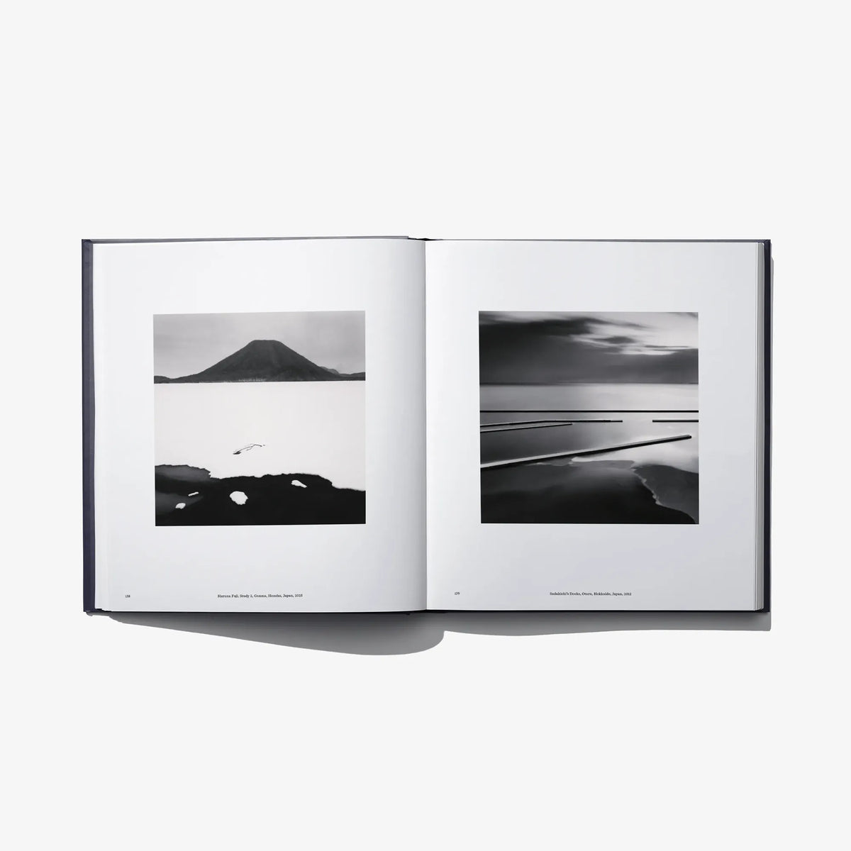 Open book “Constellation” spread featuring two black-and-white horizon photos.