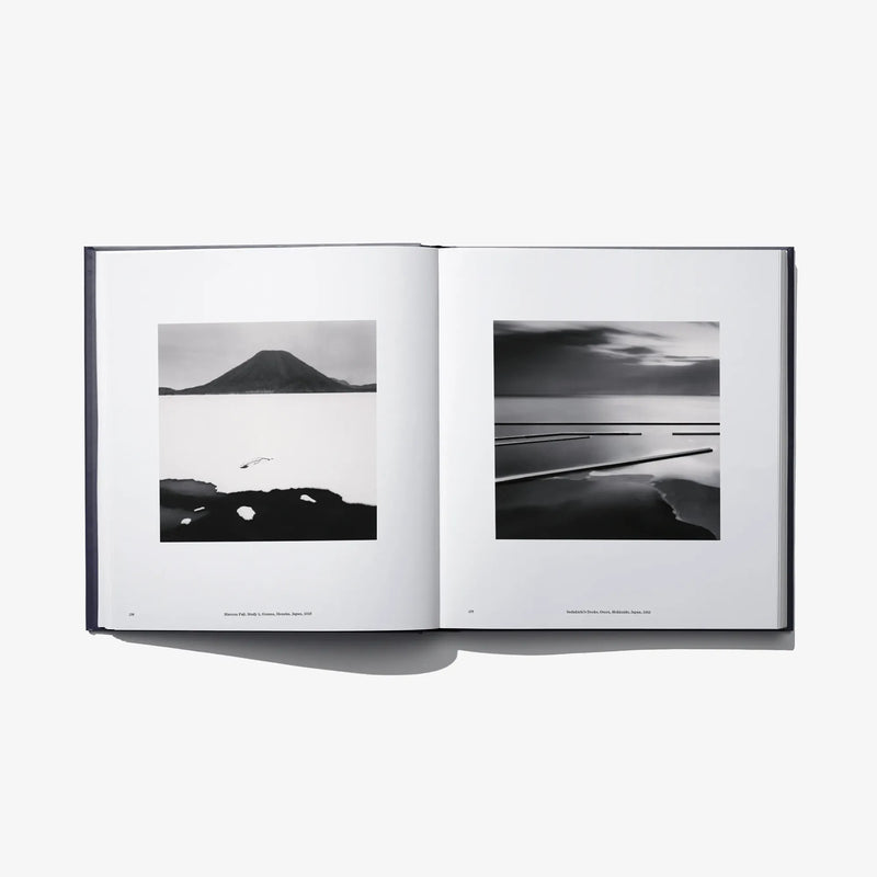 Open book “Constellation” spread featuring two black-and-white horizon photos.