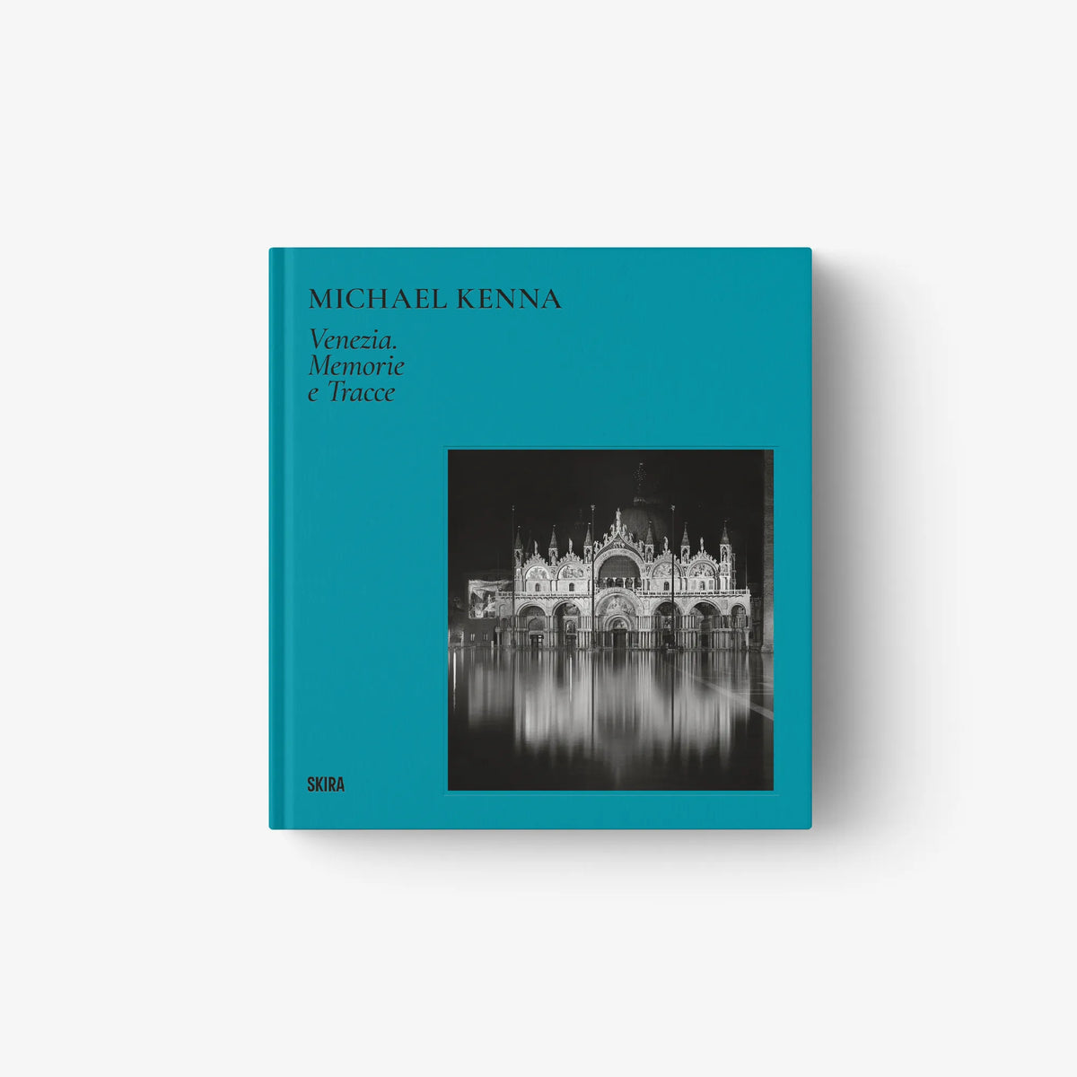 Teal hardcover book with square black-and-white Venice photo and title text