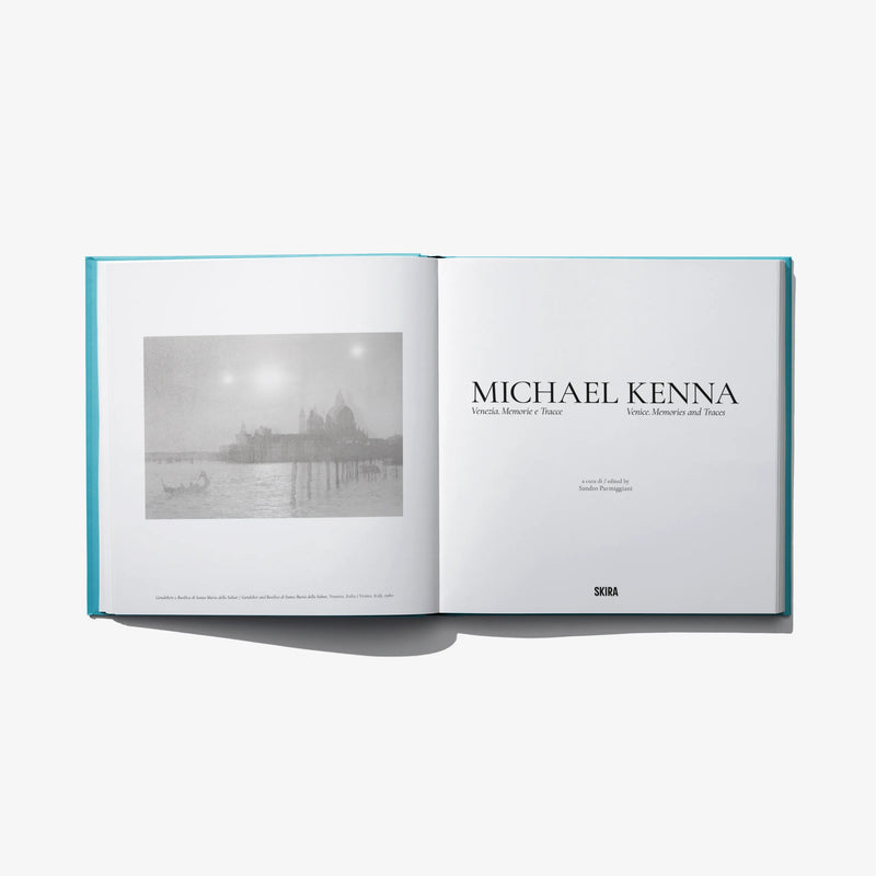 Open photo book with black-and-white Venice print and title text on right page.