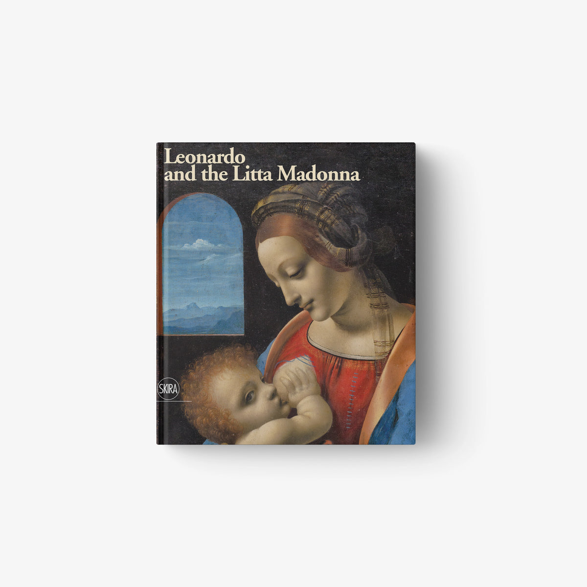 Art book with cover painting of Madonna holding baby, arched window background