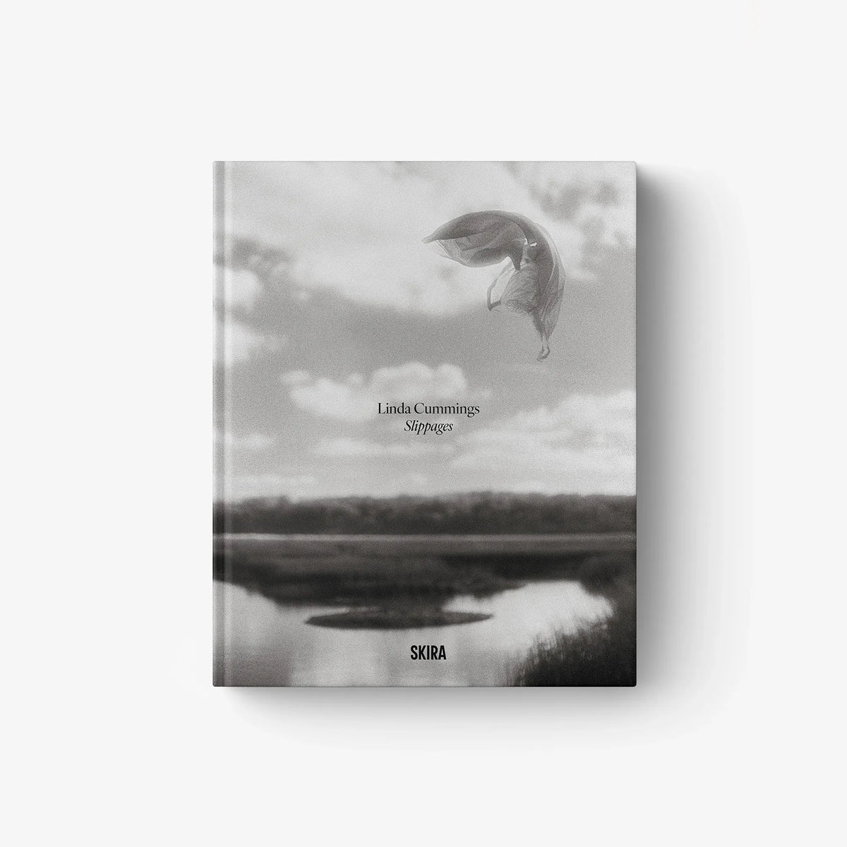 Slippages photo book cover with grayscale sky and bird-like figure; SKIRA