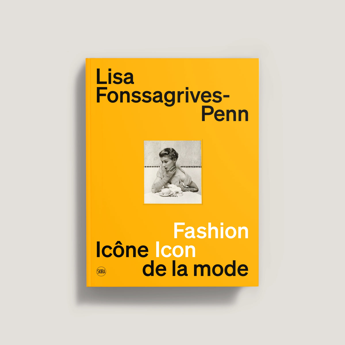 Bright orange book cover with black and white photo of a woman, titled Lisa Fonssagrives-Penn Fashion Icon.