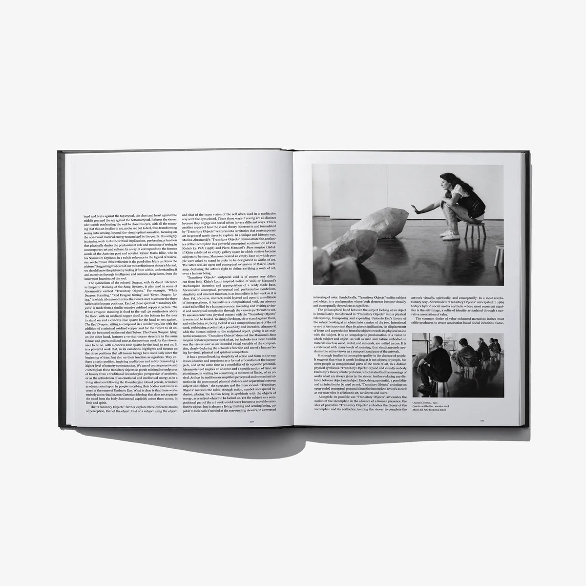 Open photo book spread with blocks of text and black-and-white action photo insets.