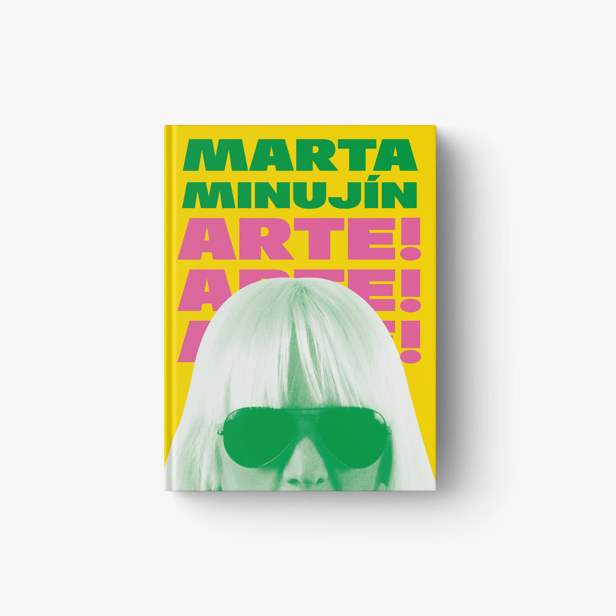 Hardcover art book volume by Skira Arte with Marta Minujin cover, yellow and pink lettering and green illustration