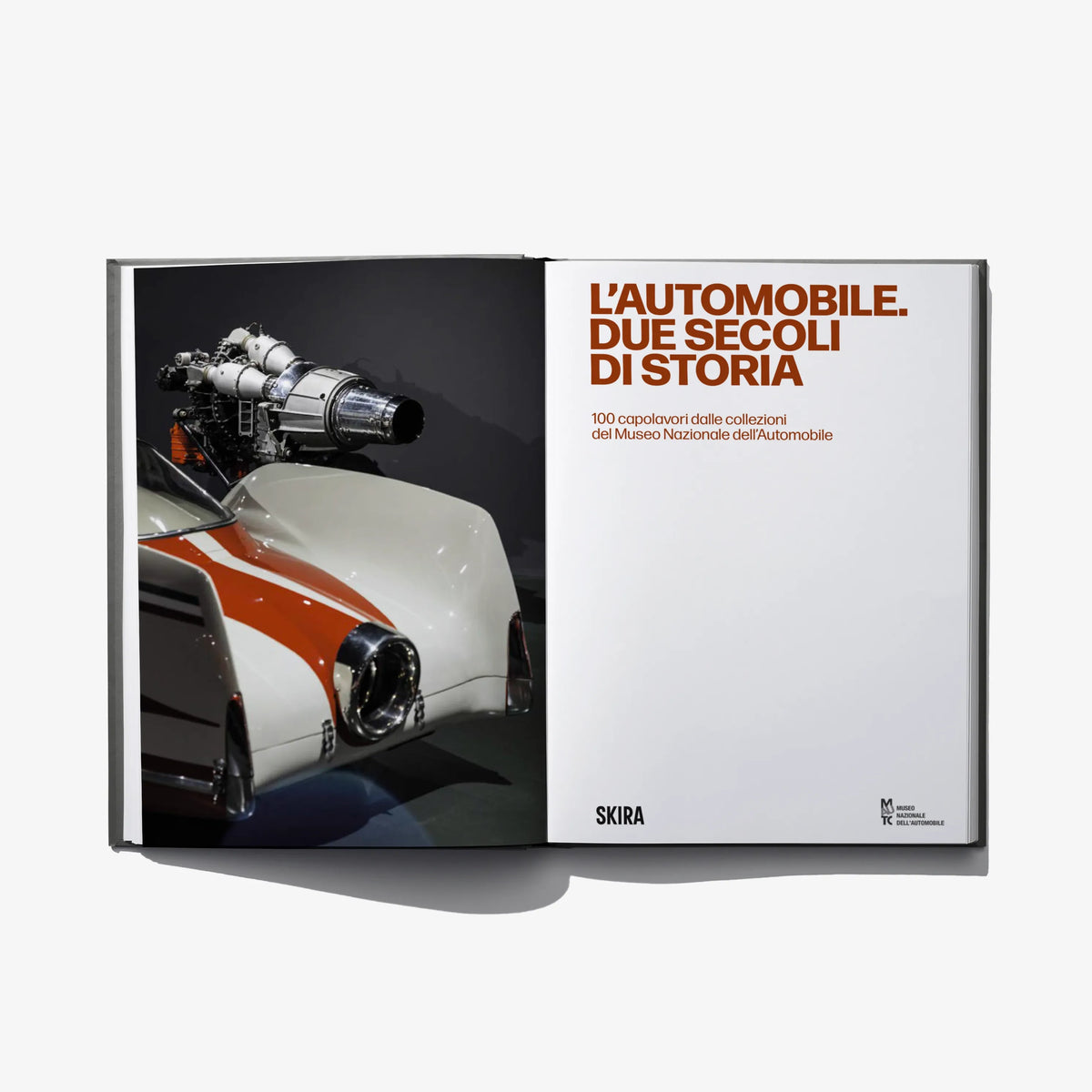 Open book spread showing orange classic car and a vintage engine illustration