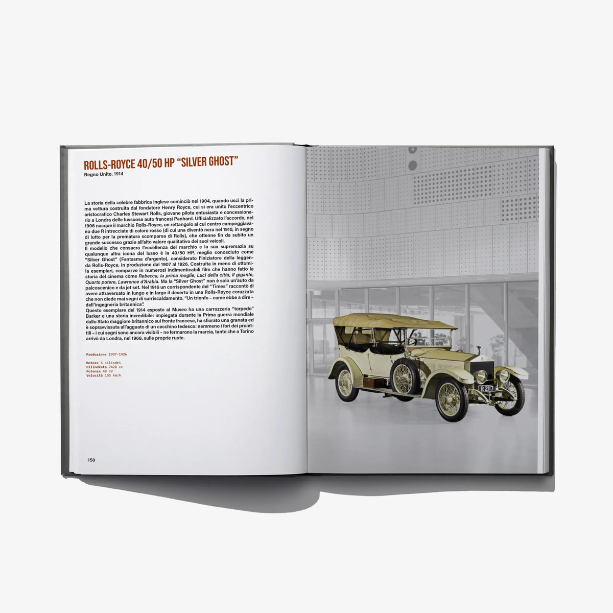 Open book spread featuring a yellow vintage car on the right page