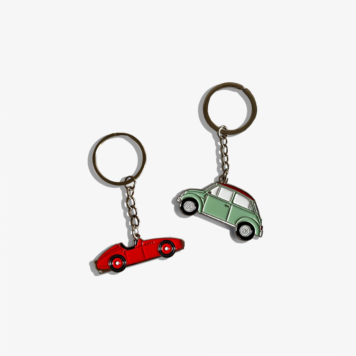 Automobile keychain set with red and green car charms, metal rings and chains