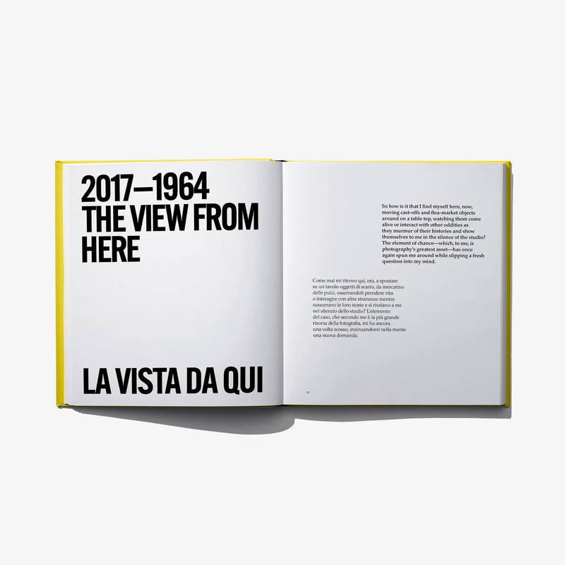 Open photo book spread with bold cover-style title text on the left page.