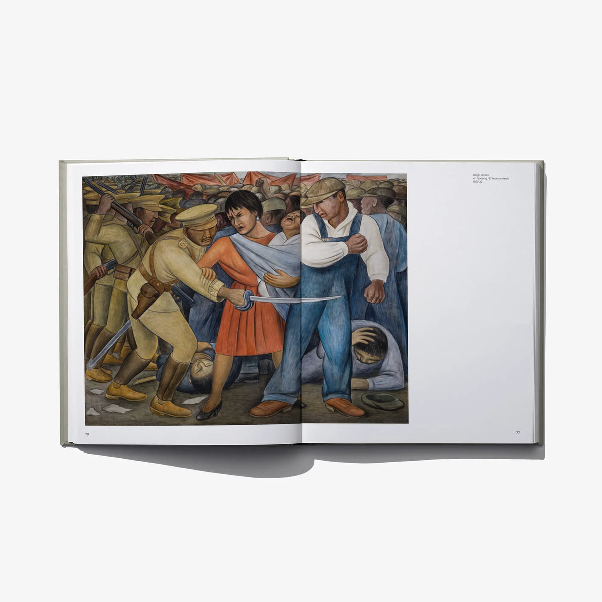 Open art book spread with large mural-style painting on the left page