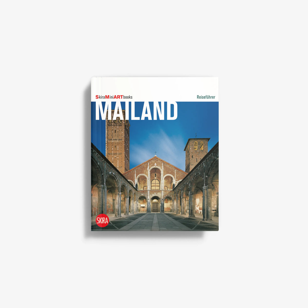 Mailand art book with Skira cover, illustrated city skyline and archway.